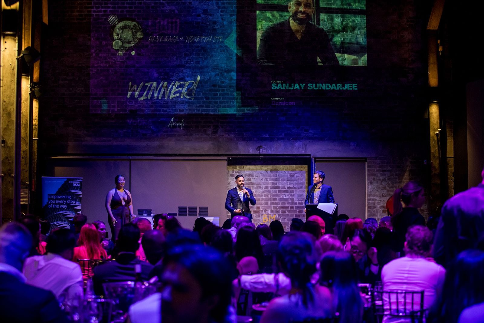 2025 Sydney Young Entrepreneur Awards Gala Dinner Winners accepting trophies on stage at the 2025 Sydney Young Entrepreneur Awards